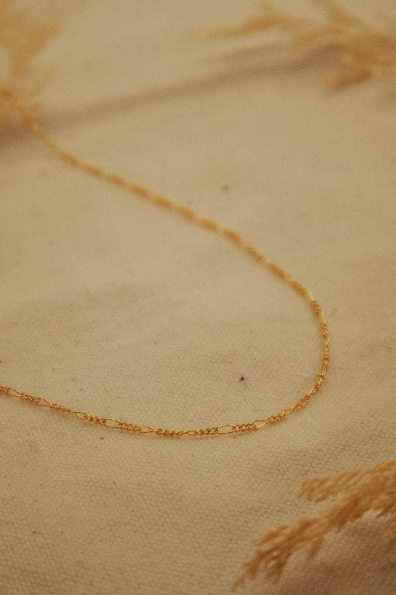 The Gold Figaro Chain